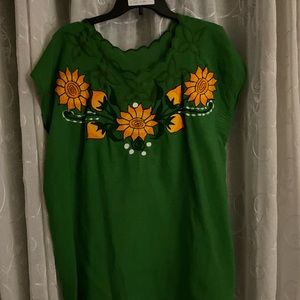 Dark green shirt with bright sun flowers & little ruffle design at the neck